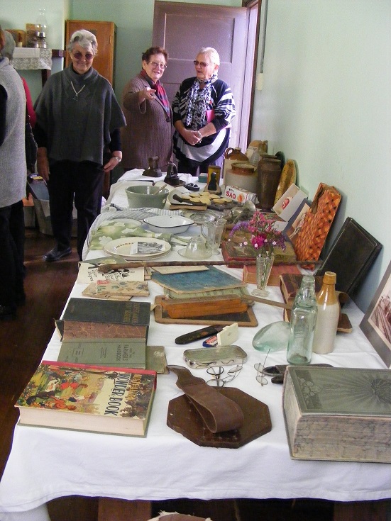 Eileen Kilpatrick, Elaine Lockett and Joan Willsmore discuss the display