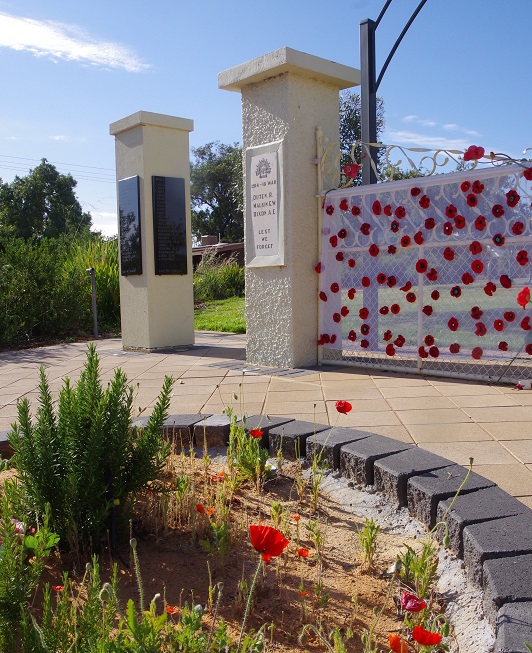 WW1 commemoration pillars and memorial garden of Flander's poppies and Rosemary