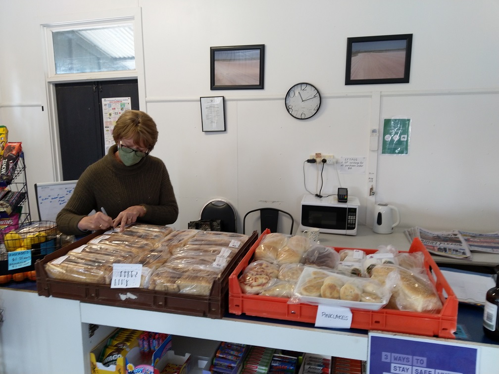 Helen(B) processing the bakery order at Pink Lakes Pantry